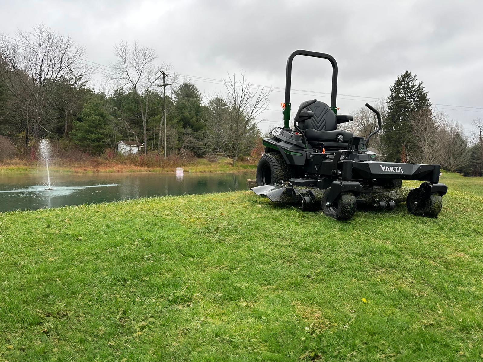 Yakta YXR710 Zero-turn Lawn Mower sitting in front of pond